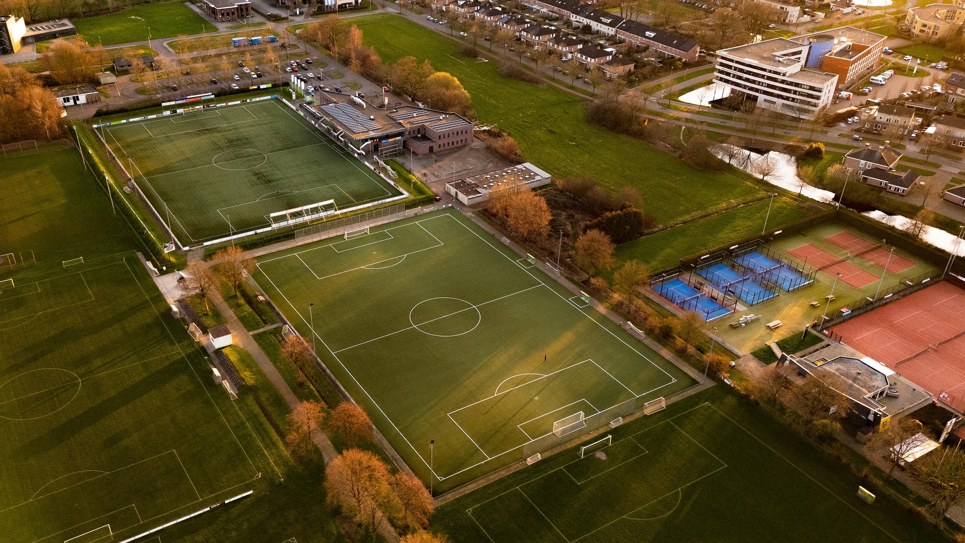 Aerial view of a football complex with multiple pitches