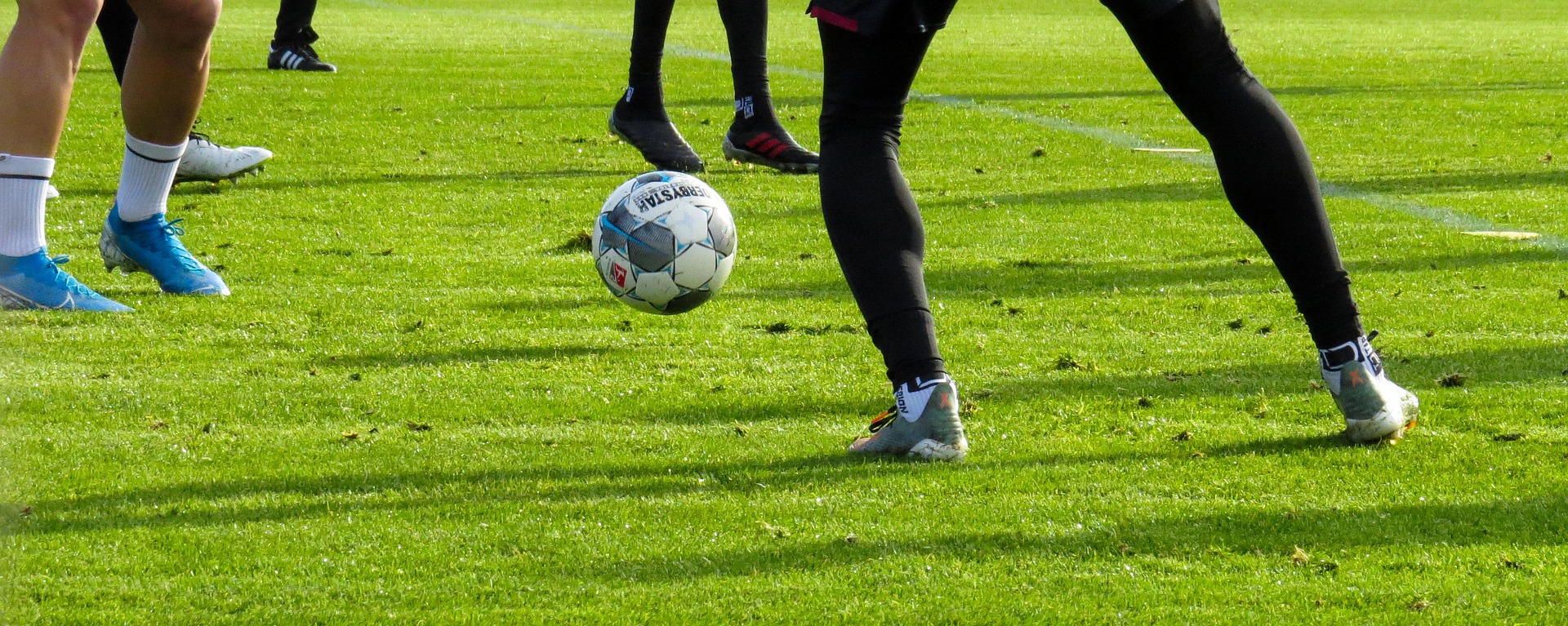 Players contesting the ball during a football match