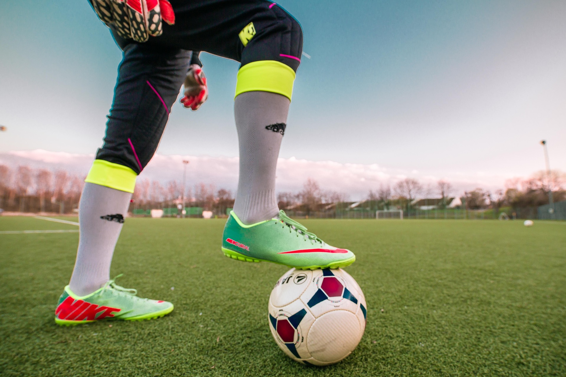 Football player controlling the ball on the pitch